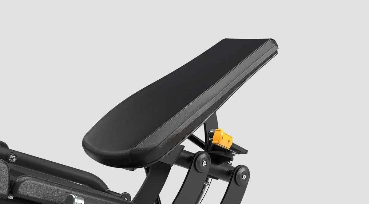 Close-up of the adjustable backrest on the Matrix Fitness Incline Leg Extension machine in Matte Black, with a visible yellow adjustment lever.