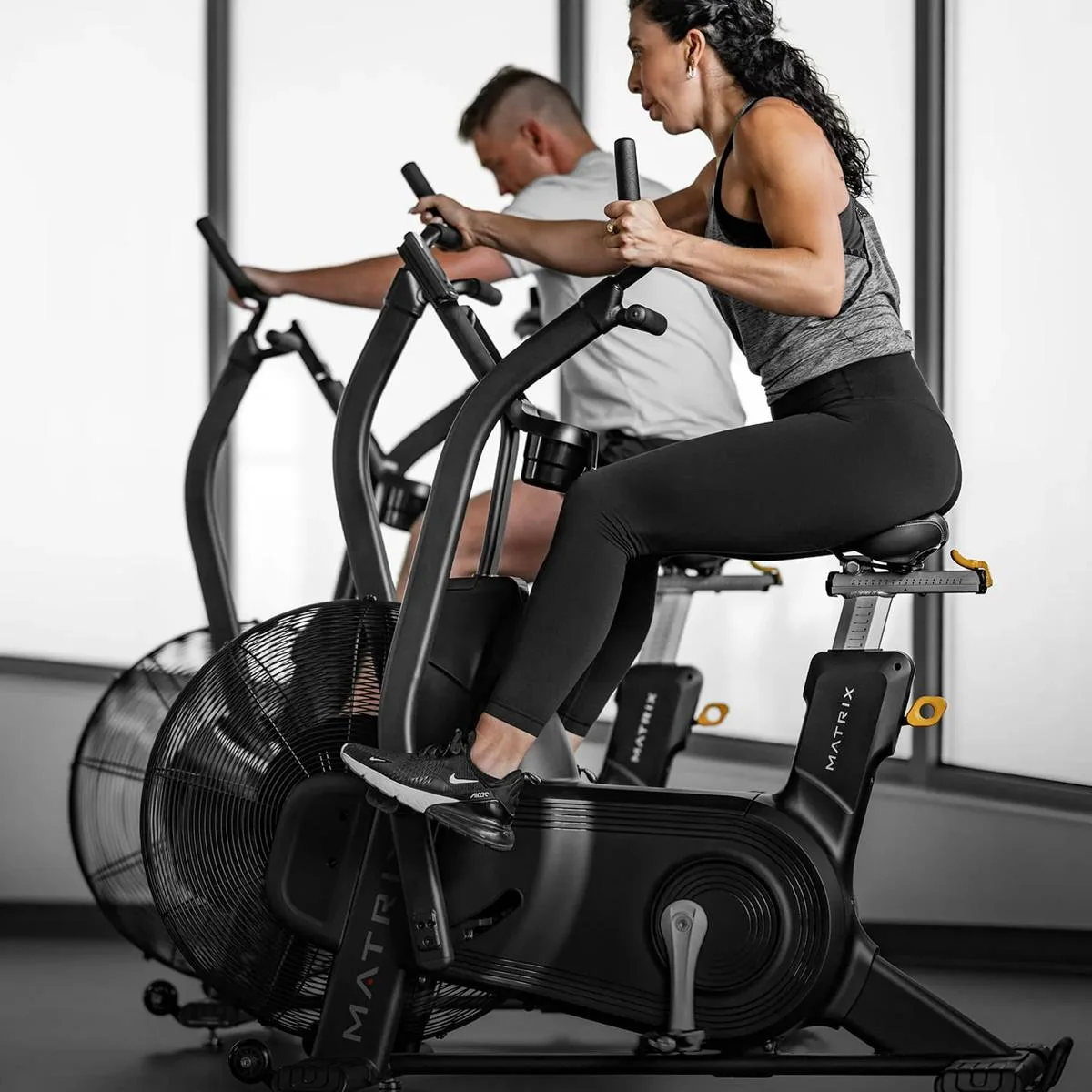 couple working out on cycles