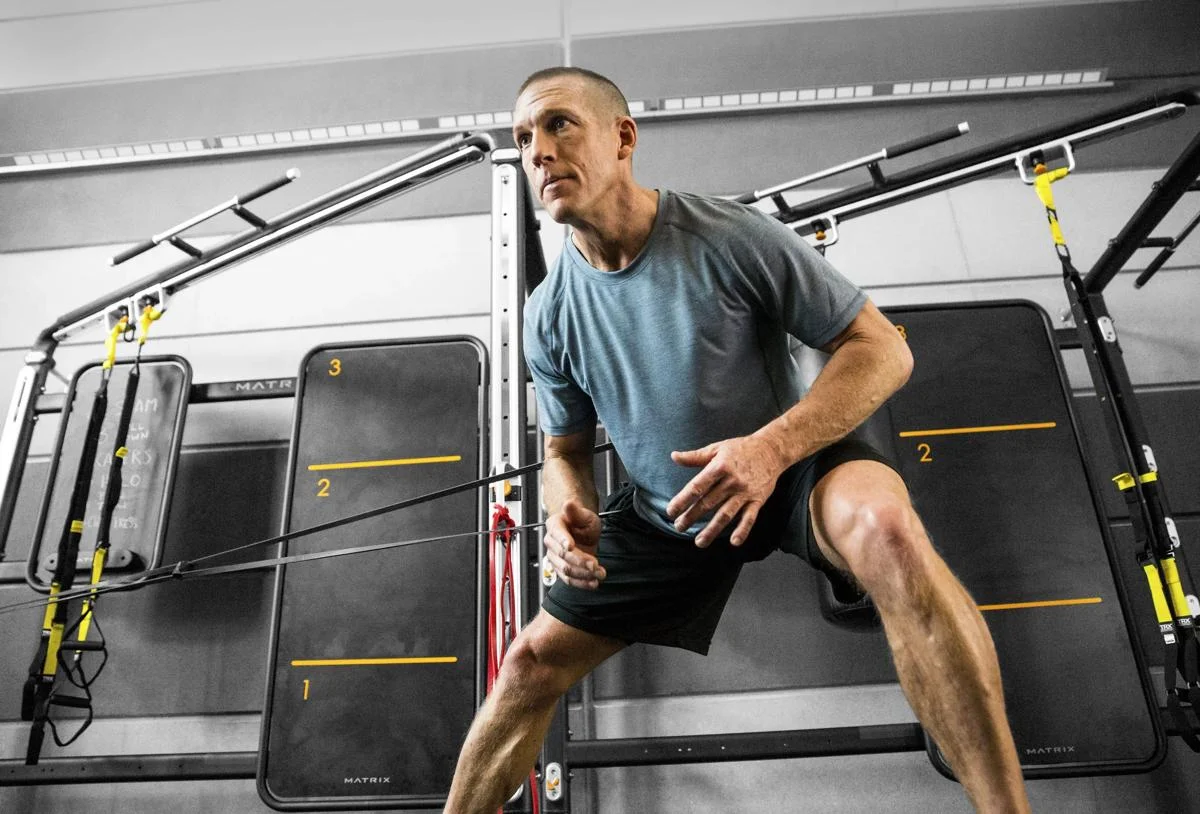 Man using Connexus with resistance bands