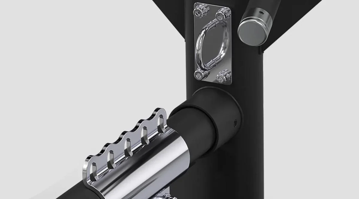 Close-up of the chrome adjustment mechanism on a Matrix Fitness machine in Matte Black, featuring a notched selector bar and mounted anchor ring.