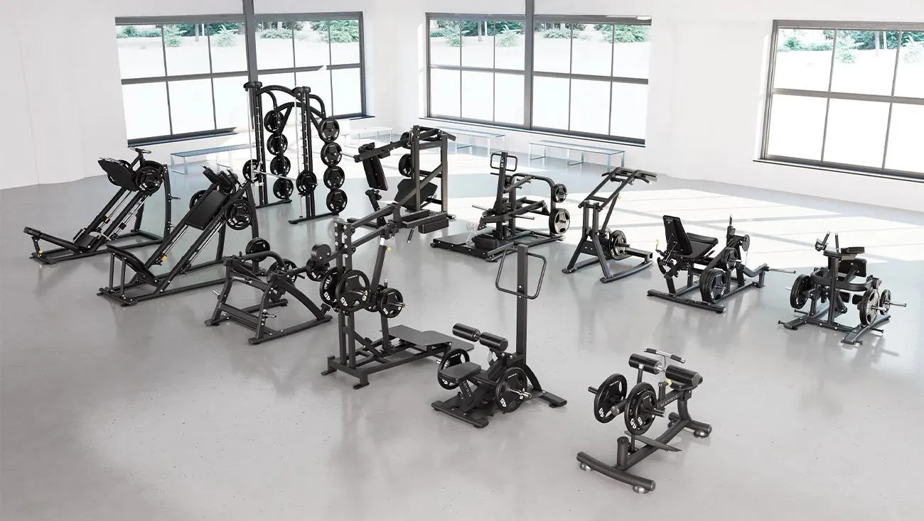 Matrix Magnum Leg Package in Matte Black featuring 12 machines for lower-body training: Reclining Leg Extension, Kneeling Leg Curl, Belt Squat, Pendulum Squat, Standing Hip Thrust, Smith Machine, Squat/Lunge, Hack Squat, 45° Leg Press, Standing Calf, Seated Calf, and Xult Perfect Squat, arranged in a bright gym with floor-to-ceiling windows.