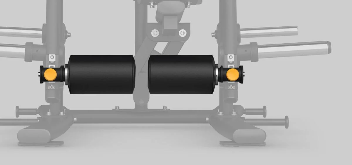 Front view of dual leg rollers with yellow adjustment knobs on a Matrix Fitness leg machine in Matte Black.